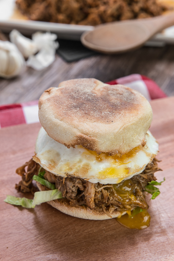 Have leftover pulled pork? Try this crazy simple English muffin recipe! Crisp and fluffy muffins wrapped on flavorful and moist pulled pork, topped with a bursting egg yolk and lettuce crunch.