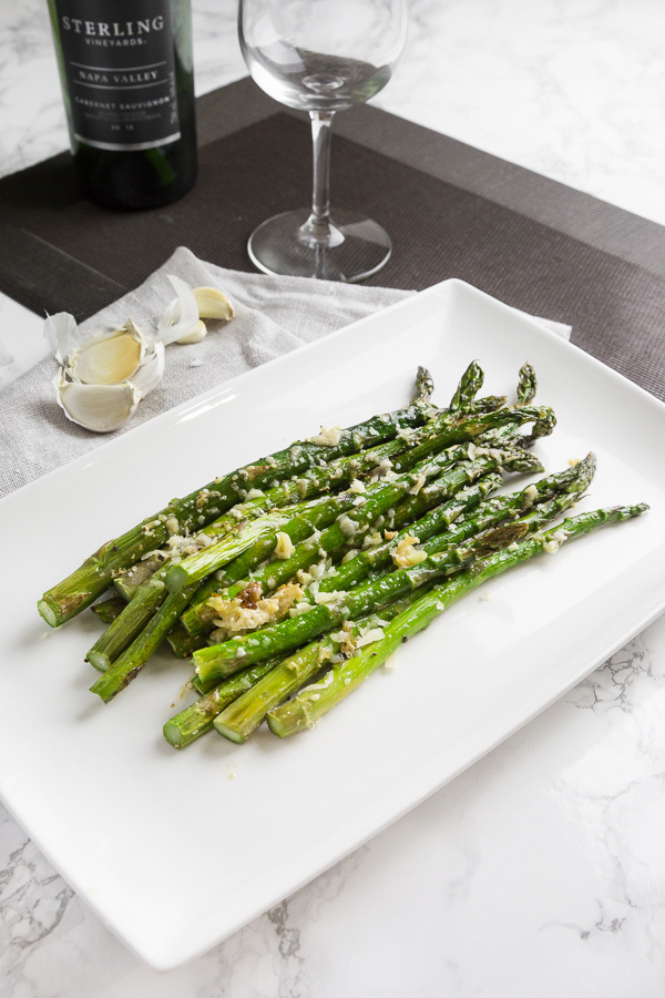 Make this easy roasted asparagus healthy side dish in 20 minutes! Parmesan-coated green stalks are perfectly crisp-tender. Pure flavorful and delicious! nomrecipes.com